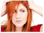 unhappy redhead woman